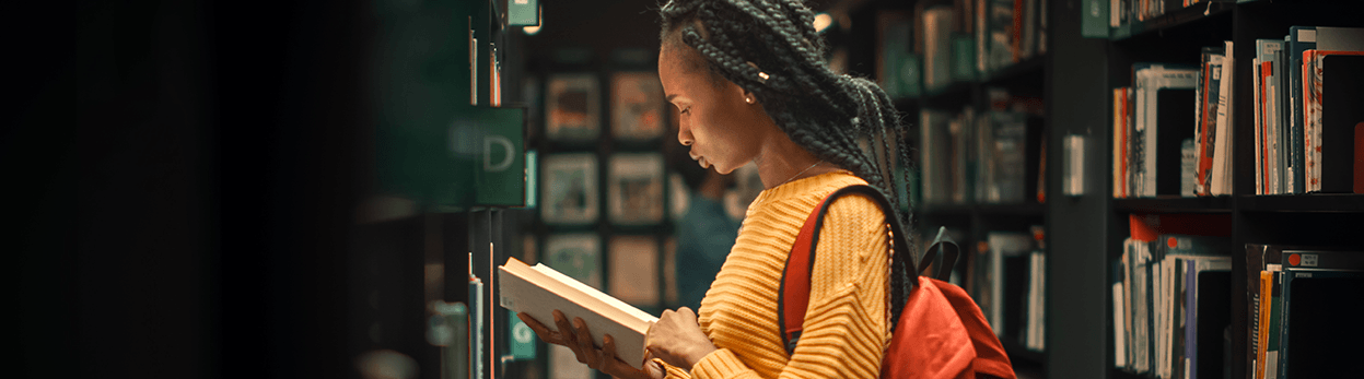 Girl in a library Reading