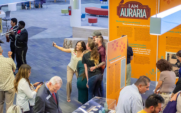 visitors enjoying the I Am Auraria exhibit