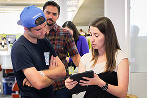 library employees helping faculty