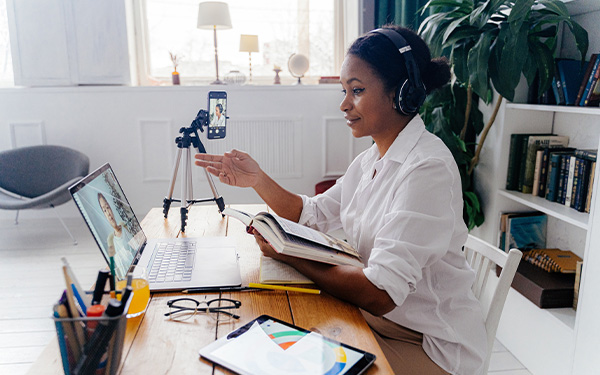 Professor teaching students remotely from an office