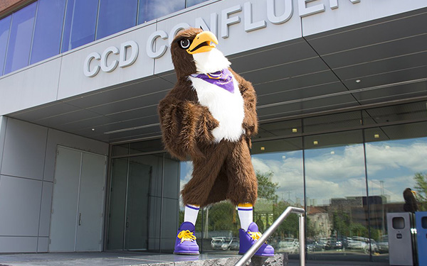 Swoop standing on steps in front of a CCD building