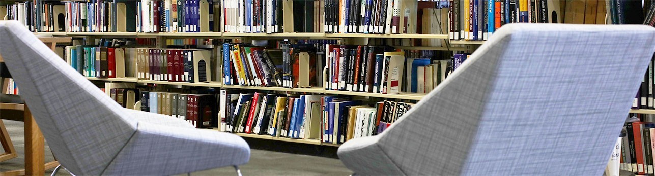 chairs next to a stack of library books