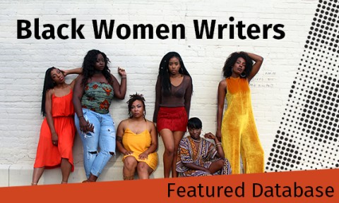 Black women pose against a brick wall