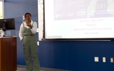 Auraria Creates member presenting in front of a big screen