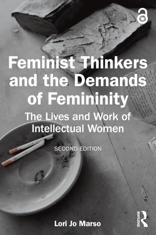 Cover of "Feminist Thinkers and the Demands of Femininity" with an ashtray on a wooden table, evoking a contemplative, intellectual tone.