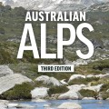 Cover of "Australian Alps" showing rocky terrain and green hills under a clear blue sky. Title in bold white, with "Third Edition" below.