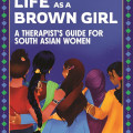 Book cover titled "Navigating Life as a Brown Girl" shows four South Asian women standing closely, embracing, with supportive and caring expressions against a starry night sky. Written by Fahima Ali.