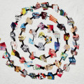 Colorful collage pieces arranged in a spiral pattern on a textured white background. The words "Vitamin C+" and "Collage in Contemporary Art" are visible.