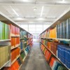 looking down an aisle of library stacks