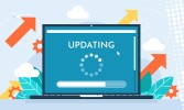 laptop with "updating" written across the screen