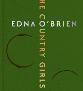 Green book cover with the title "The Country Girls" in gold, vertical text. "Edna O'Brien" appears horizontally in silver. Two dark brown semi-circles add a vintage feel.